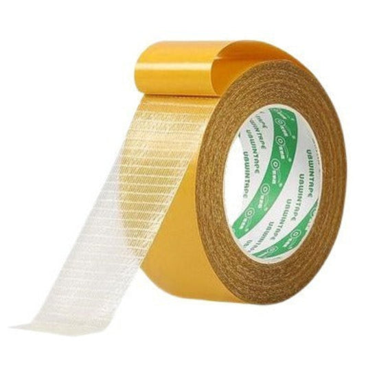 Roll of gold tape with a white strip on a white background