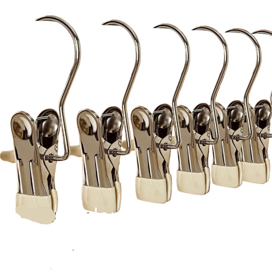 Set of metal clamps on a wooden background with text highlighting their strength.