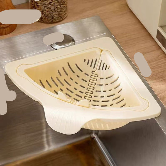 Beige sink strainer on a kitchen sink with measurements indicated