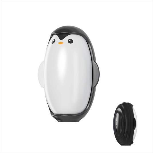 Penguin-shaped camera lens cap on a white background