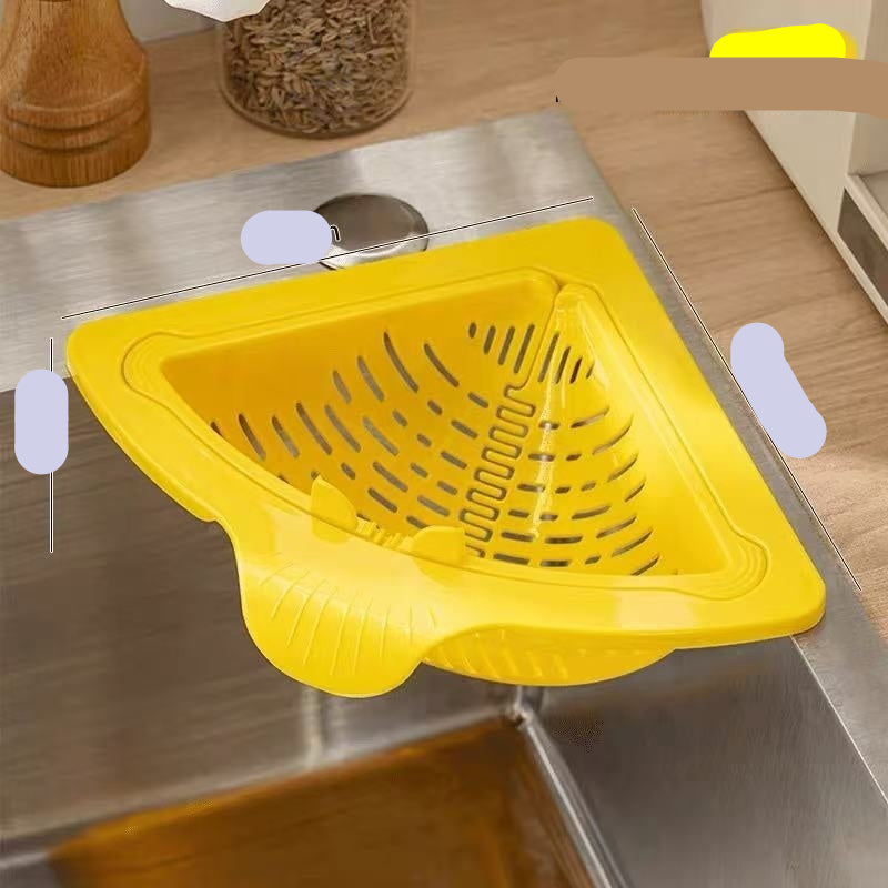 Yellow kitchen sink strainer on a stainless steel sink with measurements indicated.