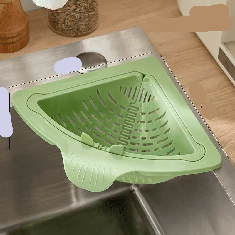 Green kitchen sink strainer on a stainless steel sink with measurements indicated.