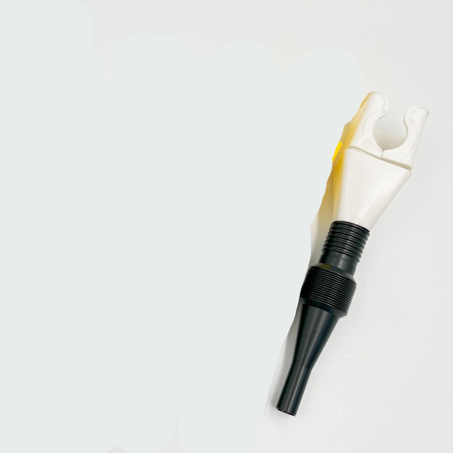 White and black tool funnel on a light gray background