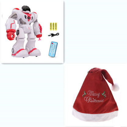 Toy robot with remote control and Christmas hat on a white background