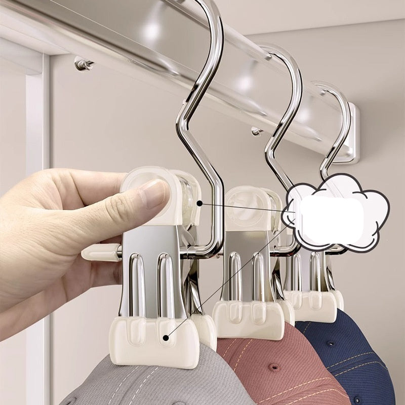 Hand holding a metal hanger with multiple hooks, attached to a wardrobe door, with a 'upgrade' label.