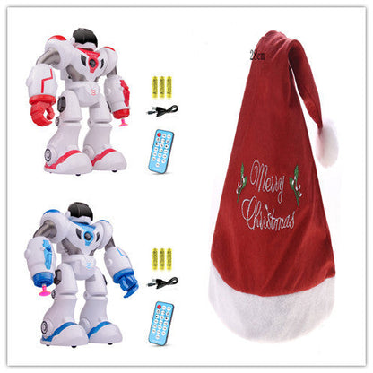 Two robot toys with remote controls and a red Christmas hat on a white background.
