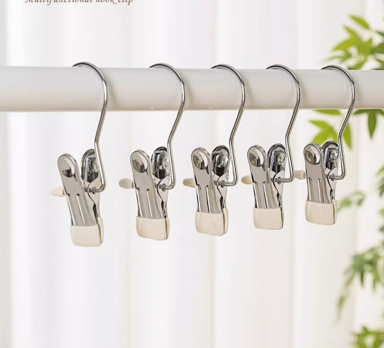 Multi-function hook clip on a white background with text describing its features.