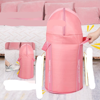 Pink baby seat with text on stability and safety features, placed on a pink couch.