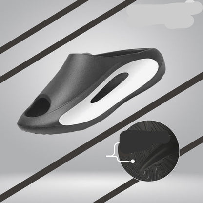 Black slip-on shoe with a slick resistant design on a gray background