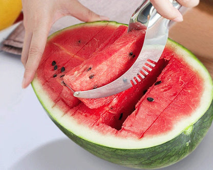 Person using a watermelon slicer to cut into a watermelon