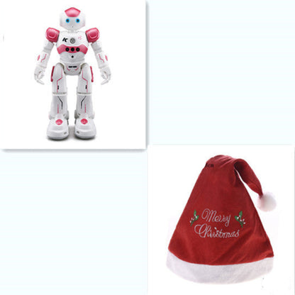 White robot toy and red Christmas hat with 'Merry Christmas' text on a white background