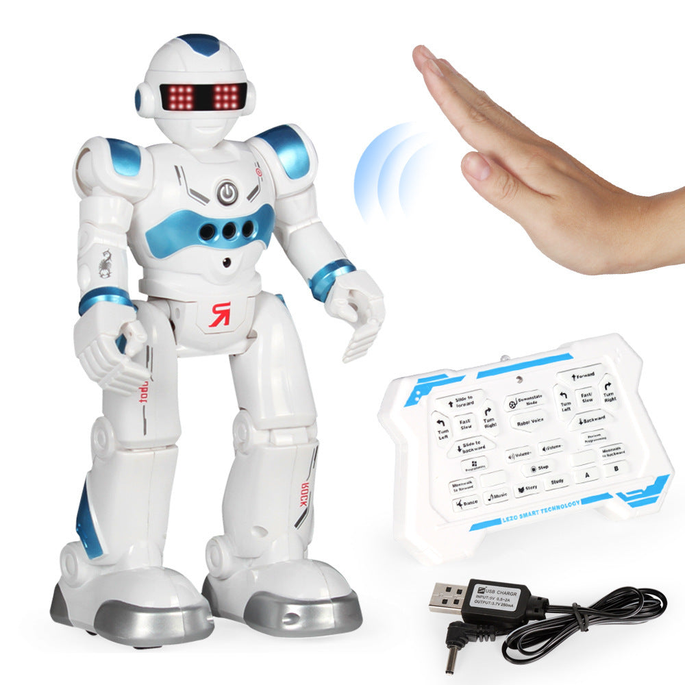 White and blue robot toy with remote control and USB cable on a white background