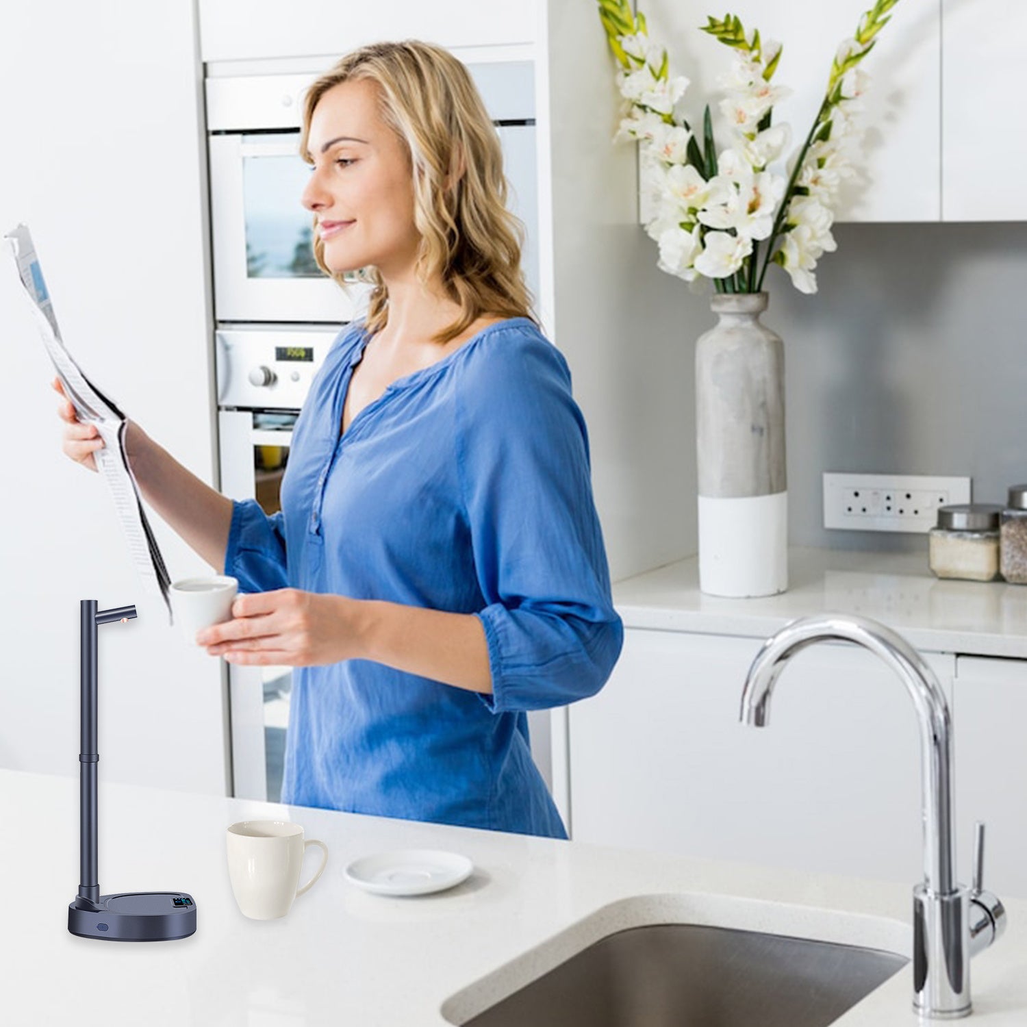 Woman in a kitchen holding a newspaper, with a sink and countertop visible.