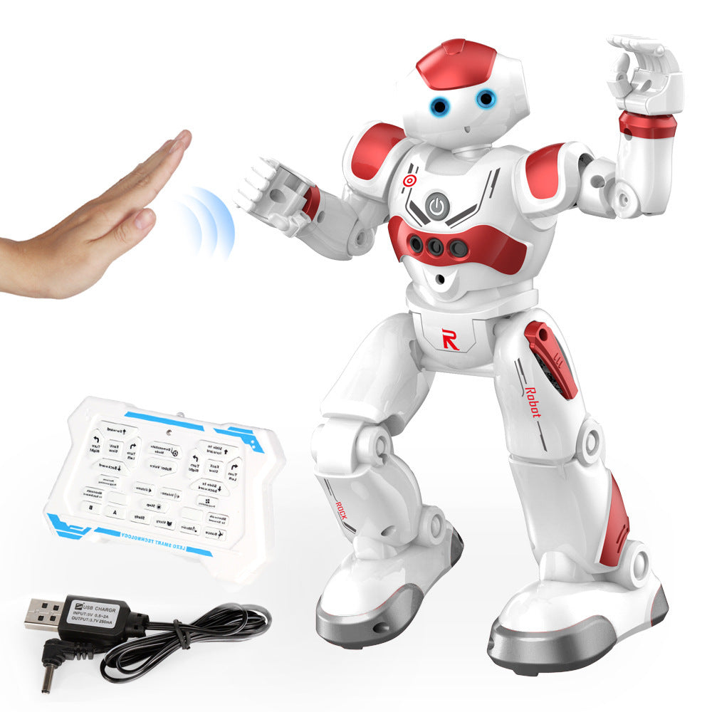White and red robot toy with remote control and USB cable on a white background