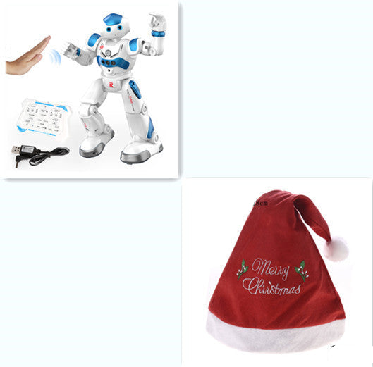 White robot toy with blue accents on a white background, next to a red Christmas hat with 'Merry Christmas' text.