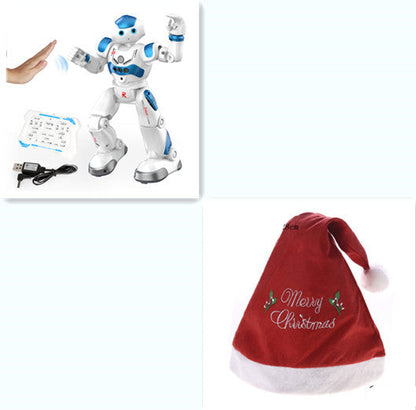 White robot toy with blue accents on a white background, next to a red Christmas hat with 'Merry Christmas' text.