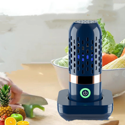 Blue kitchen device on a table with fruits and vegetables in the background