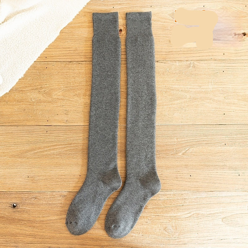 Dark grey knee-high socks on a wooden surface with 'Dark grey' text.