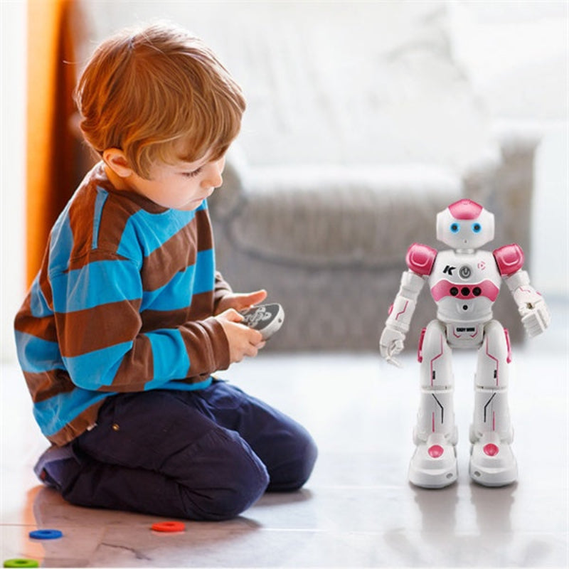 Child playing with a robot toy on a light-colored floor.
