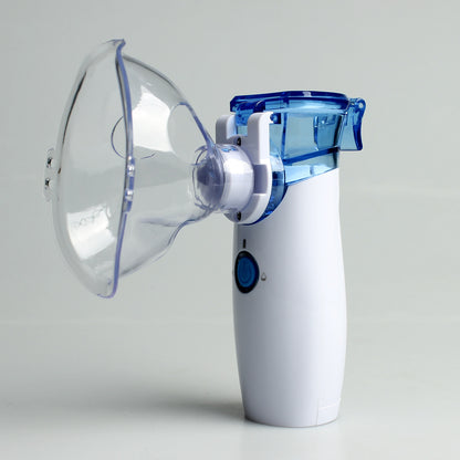 White and blue handheld inhaler device on a light gray background