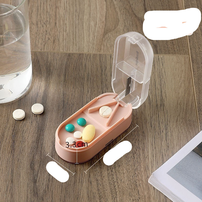 Pink pill organizer with colorful pills on a wooden surface, next to a glass of water.