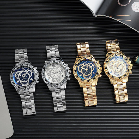 Four watches in silver and gold on a black textured surface
