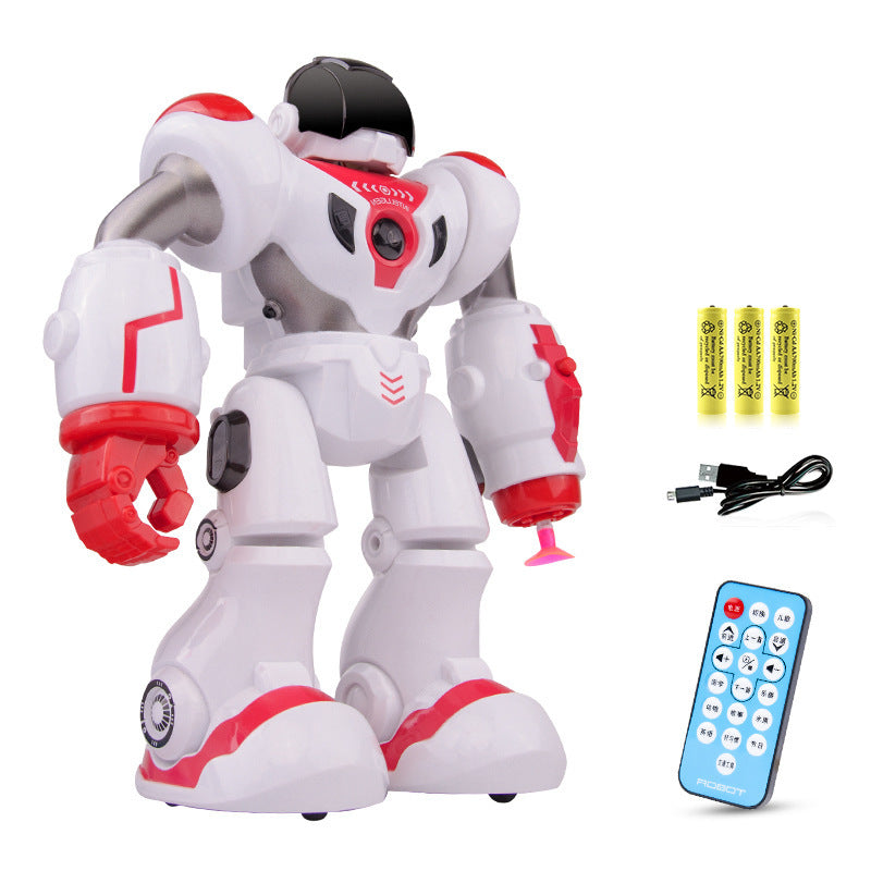 Toy robot with remote control, batteries, and USB cable on a white background