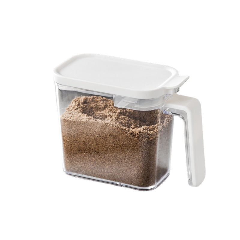 Clear container with brown sand-like substance on a white background