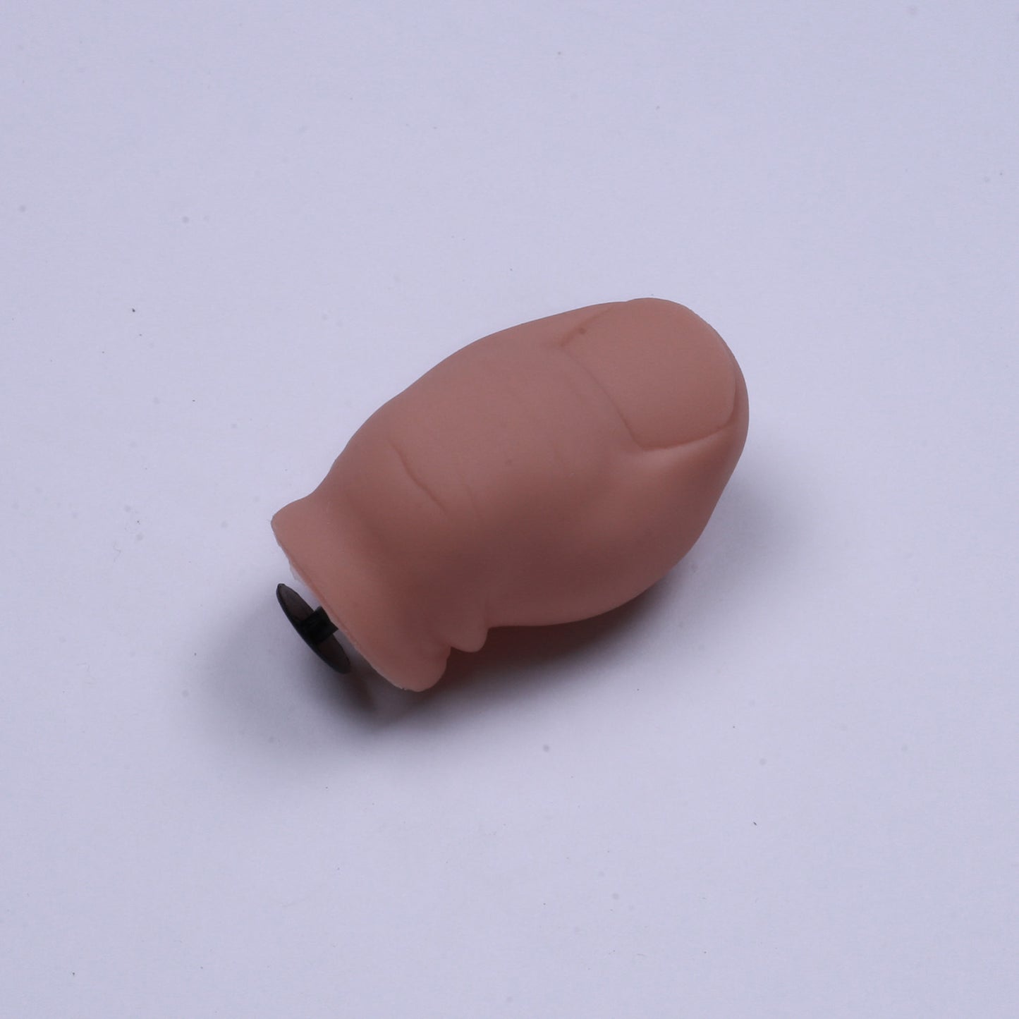 Brown rubber duck on a white background