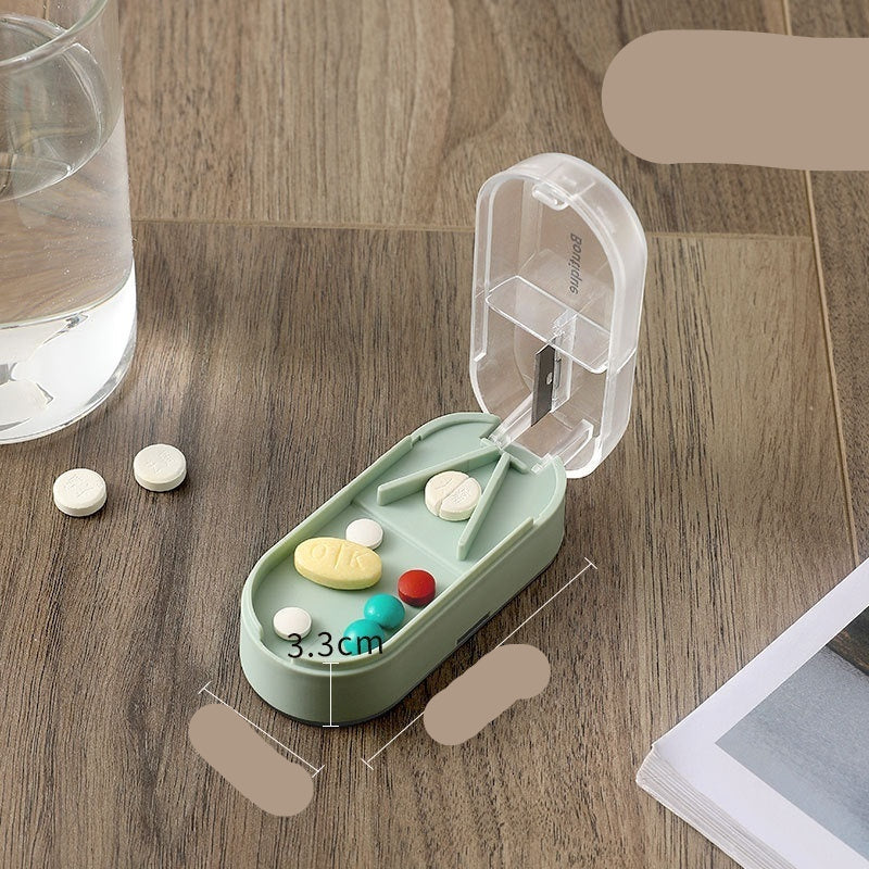 Green pill organizer with measurements on a wooden surface