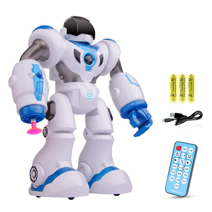 Toy robot with remote control, batteries, and USB cable on a white background