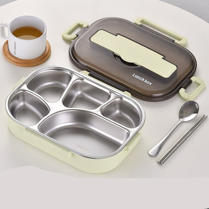 Stainless steel lunch box with compartments, spoon, and chopsticks on a white surface.