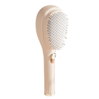 Beige hairbrush with bristle head on a white background