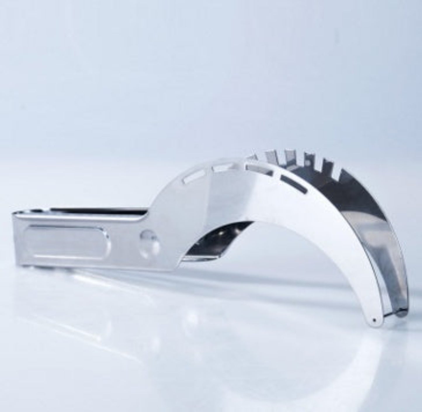 Chrome faucet handle on a white background