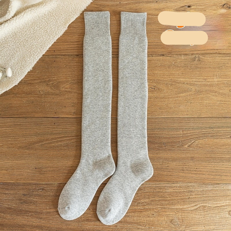 Light gray knee-high socks on a wooden surface with 'Light Gray' text.