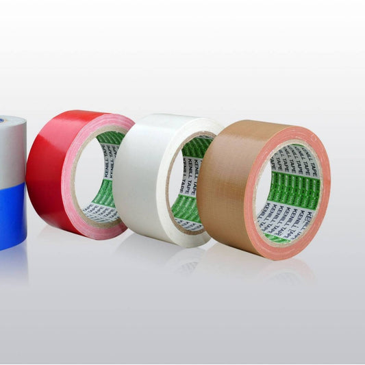 Four rolls of tape in different colors on a white background