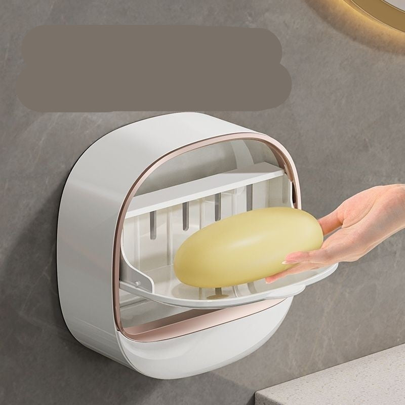 Wall-mounted soap dispenser with a bar of soap, on a neutral background.