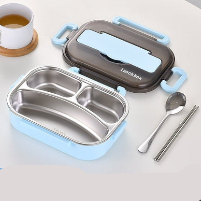 Blue and silver lunch box with compartments, spoon, and chopsticks on a light background