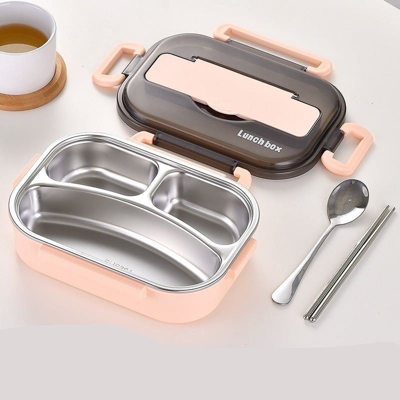 Pink lunch box with compartments, spoon, and chopsticks on a light background