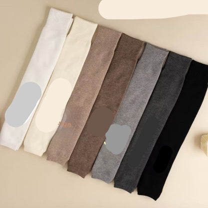 Set of plush knee socks in various colors with color names printed on them.