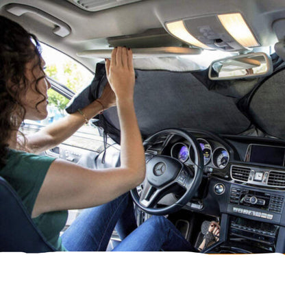 Person installing sun visors inside a car with text instructions.