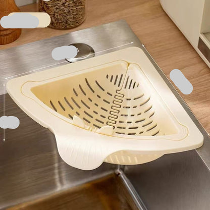 Beige sink strainer on a kitchen sink with measurements indicated