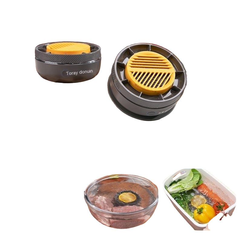 Two black and yellow kitchen tools on a counter with vegetables and a cutting board in the background.