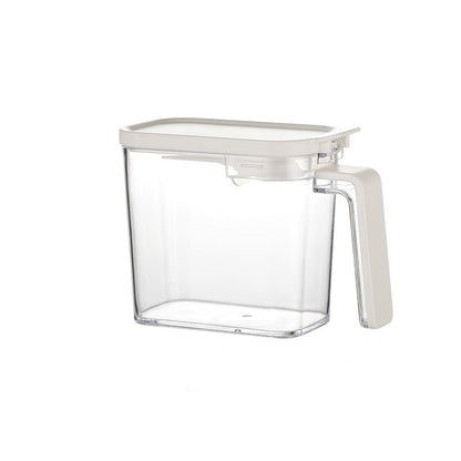 Clear container with measurements on a white background