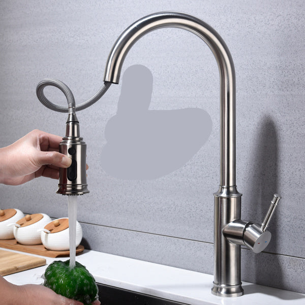 Kitchen faucet with pull-down spray wand on a gray tiled wall background