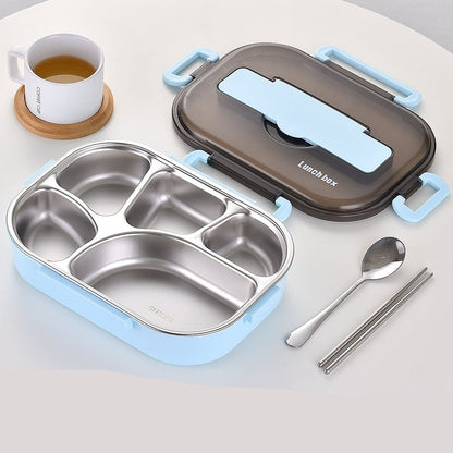 Lunch box set with compartments, spoon, and chopsticks on a light gray background
