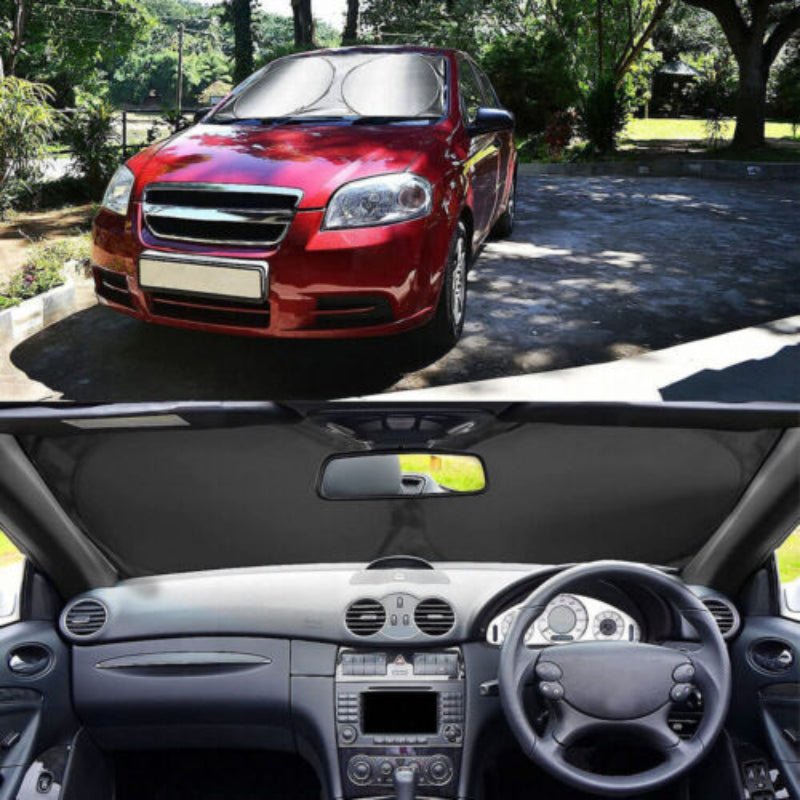 Red car parked outdoors with a close-up of the car's interior.